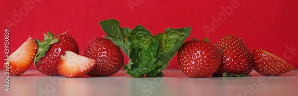 Obraz Strawberry with mint on red background