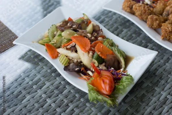 Obraz Thai Food made of plantain and chicharron served with meat and broth close-up on a plate on the table. horizontal top view from above