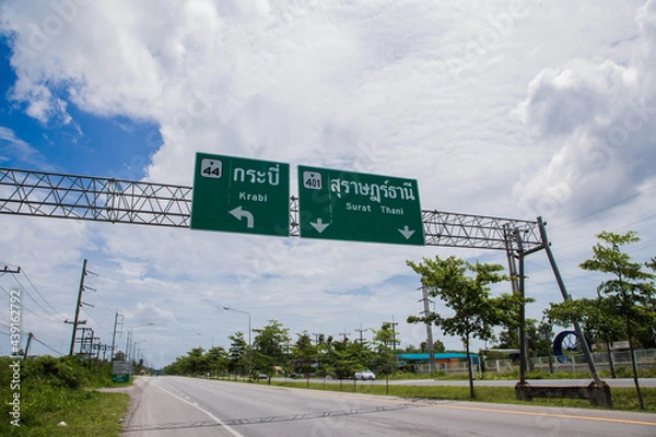 Fototapeta Road sign curved reminds the motorists and vehicles while driving with yellow sign reflecting light to be visible at night at the roadway in countryside of Thailand