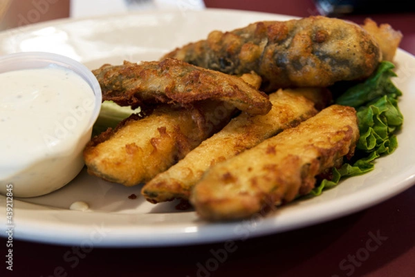 Fototapeta Deep Fried Pickles on a White Plate with Ranch Dressing on the Side