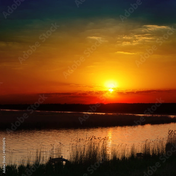 Fototapeta red sunset over river