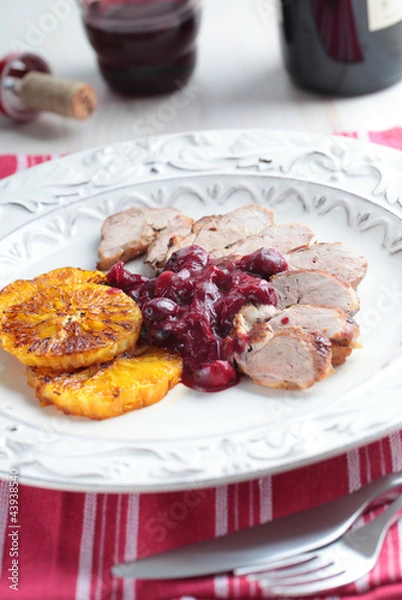 Fototapeta Duck meat with orange and cherry sauce