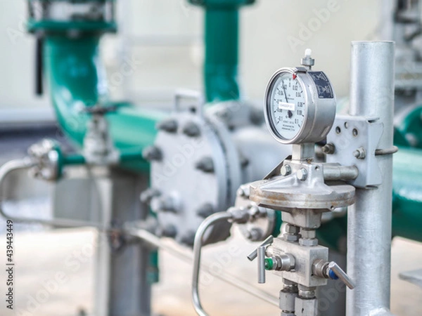 Fototapeta Pressure gauge of measuring instrument close up in industry zone at power plant with closed up