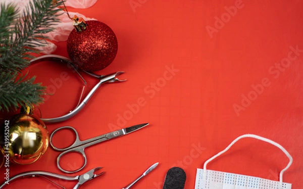 Fototapeta manicure and new year. Tools for manicure on a red background