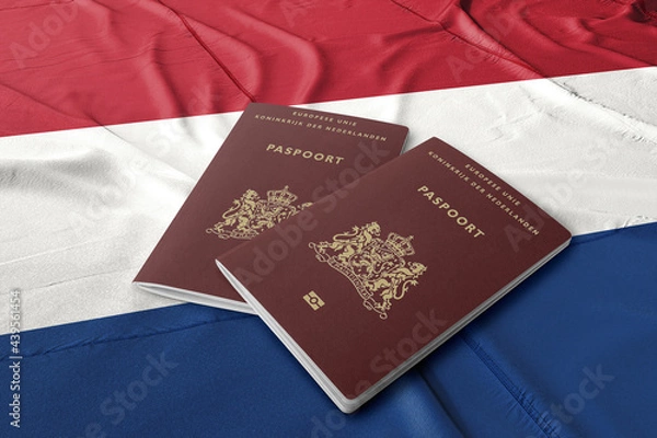 Fototapeta Netherlands passport on the Dutch flag ,Dutch passports are issued to citizens of the Kingdom of the Netherlands for the purpose of international travel.