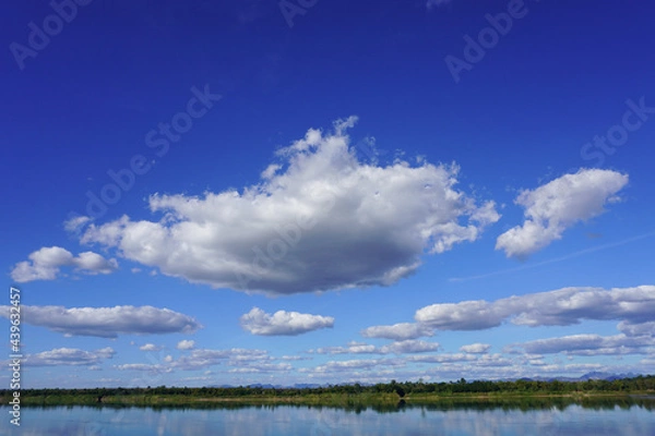Fototapeta Blue sky with clouds and a beautiful river and forest