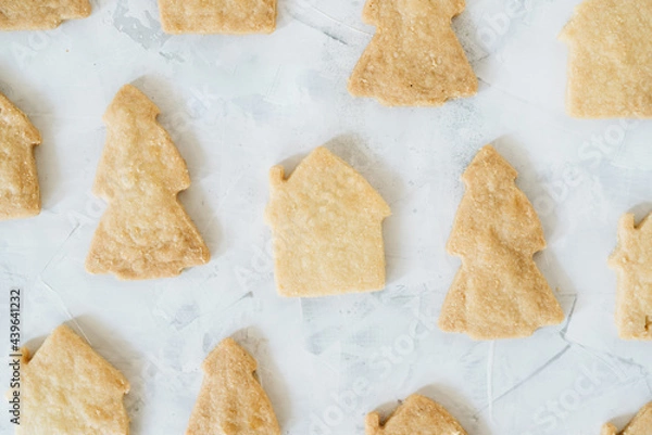 Fototapeta Flat lay of gingerbread with shape of christmas tree and houses