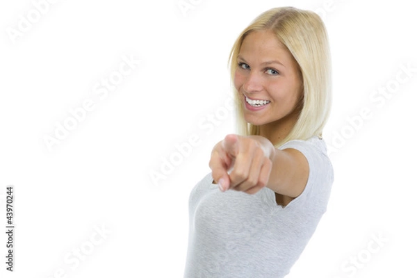 Obraz Hübsche blonde Frau zeigt mit Zeigefinger