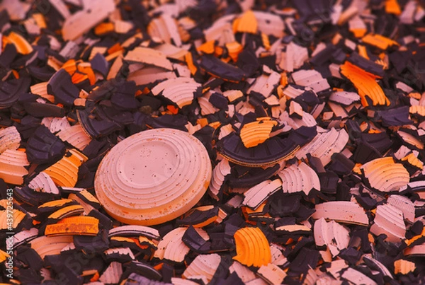 Fototapeta Shattered shotgun targets on the ground of shooting range with one target still being unbroken