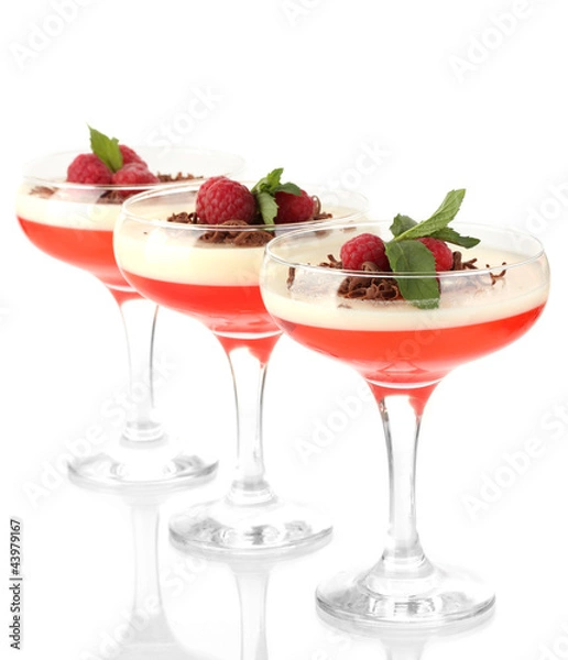 Fototapeta fruit jelly with chocolate and raspberries in glasses isolated