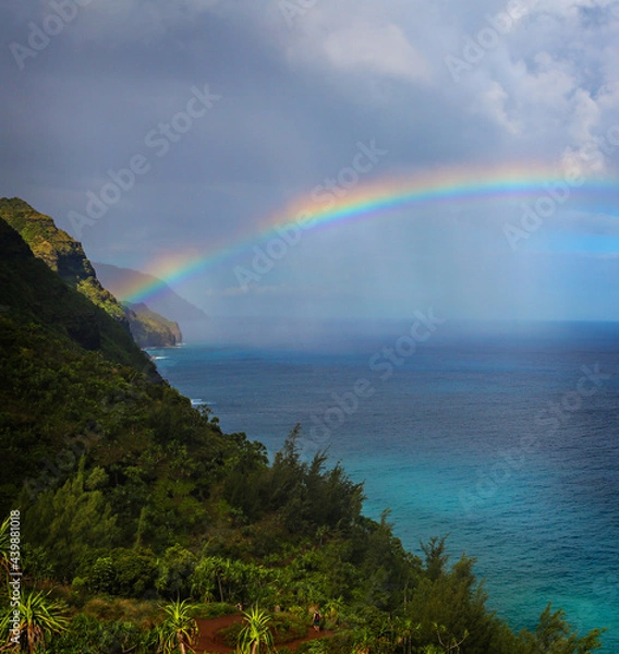 Fototapeta a view of a colorful rainbow with spectacular views of the Kalalau in Kauai, Hawaii, USA.
