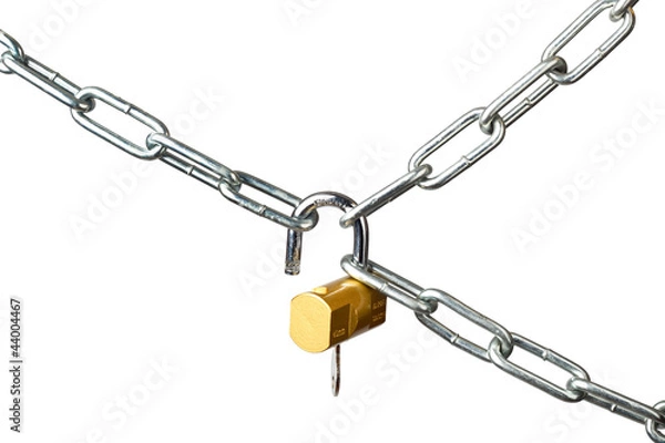 Fototapeta Unlocking a padlock securing metal chains isolated on white
