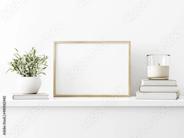 Fototapeta Horizontal wooden frame mockup with green olive twigs in vase and candle on white wall background. A4, A3, A size, 3d rendering, illustration