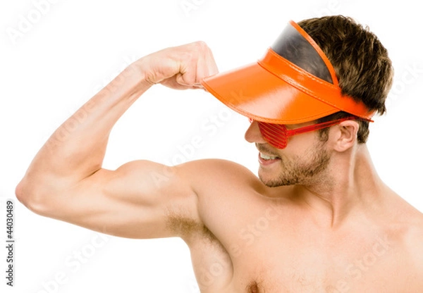 Fototapeta CLoseup of attractive young man flexing bicep muscles on white b