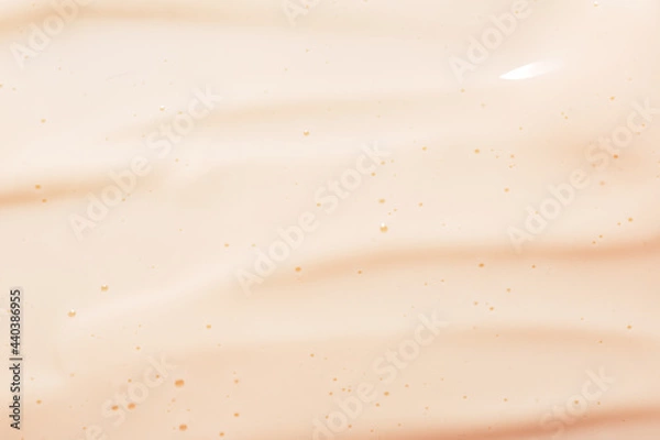 Obraz Soft creamy pink texture of a moisturizing face cream. A nourishing collagen skin care product. Smooth liquid substance of lotion, organic body milk. Mineral emulsion for eye care