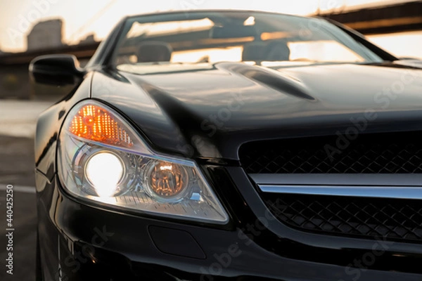 Fototapeta Luxury black convertible car outdoors, closeup view