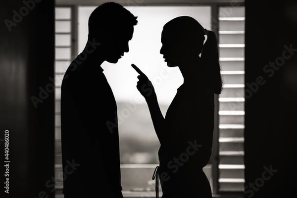 Fototapeta Young wife woman nagging her husband. Bad relationship, jealousy, frustration concept.  