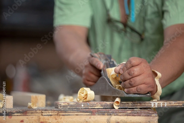 Obraz Mexican carpenter working in his workshop, close-up