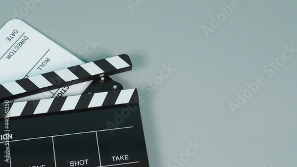 Fototapeta Black and white Clapperboard or clapper board or movie slate use in video production ,film, cinema industry on gray background.