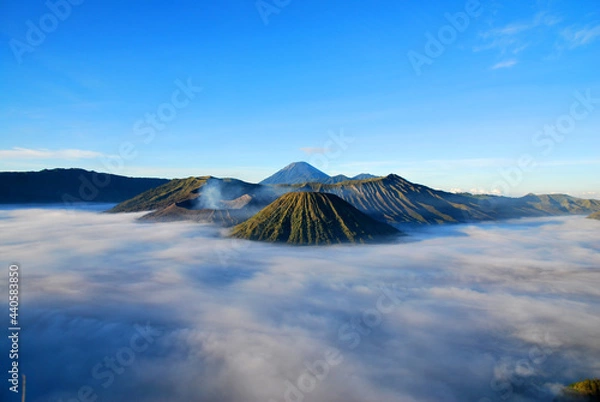 Obraz Bromo Mountain and fog around bromo mountain with sunrise from seruni viewpoint is an active volcano and part of the Tengger massif, in East Java, Indonesia. Indonesian call Gunung Bromo. Blue nature