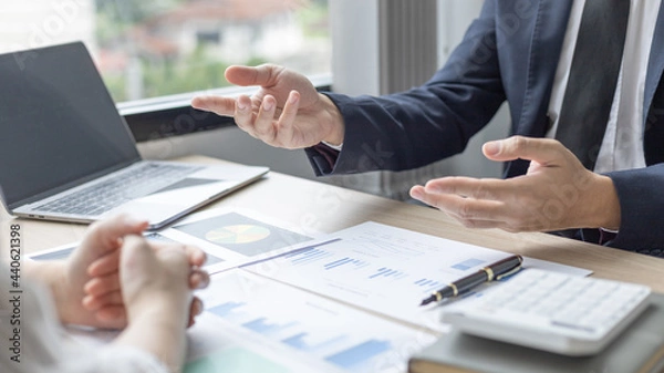 Fototapeta Brainstorm team, Marketers and financial accountants are discussing and analyzing charts to plan strategies to meet customer needs, Team meetings or business consulting.