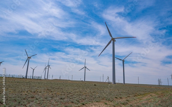 Fototapeta Wind turbines, a source of alternative energy. Wind farm