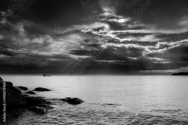Obraz Black-and-white photo of a ship at sea after a thunderstorm and a gloomy sky
