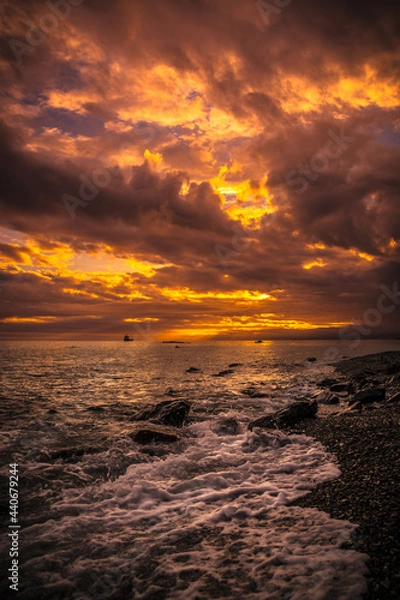 Obraz Bright colorful sunset over the sea after a thunderstorm and storm