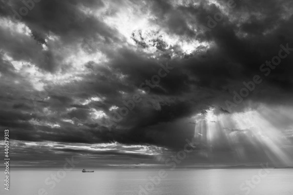 Obraz Black-and-white photo of a ship at sea after a thunderstorm and a gloomy sky
