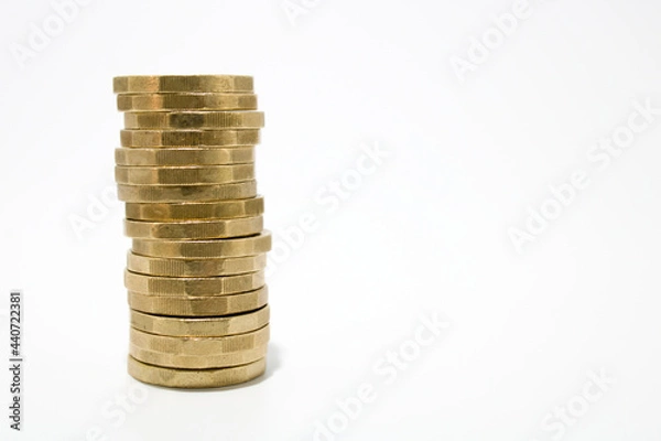 Fototapeta Single stack of one pound coins isolated on white background, with copy space