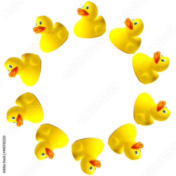 Fototapeta Rubber ducks isolated on white background in the form of a round frame. Toy animal. Template for design and print