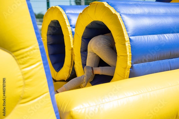 Fototapeta Inflatable tube. Rest obstacle course. Inflatable structure for fun.