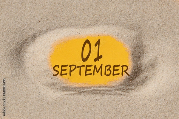 Fototapeta September 1. 1th day of the month, calendar date. Hole in sand. Yellow background is visible through hole. Autumn month, day of the year concept