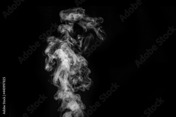 Fototapeta Perfect mystical curly white steam or smoke isolated on black background. Abstract background fog or smog
