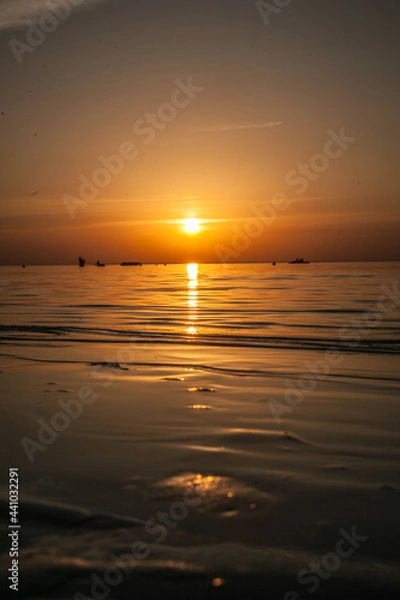 Obraz Summer sunset at sea. A resort place to relax at sunset. text place.