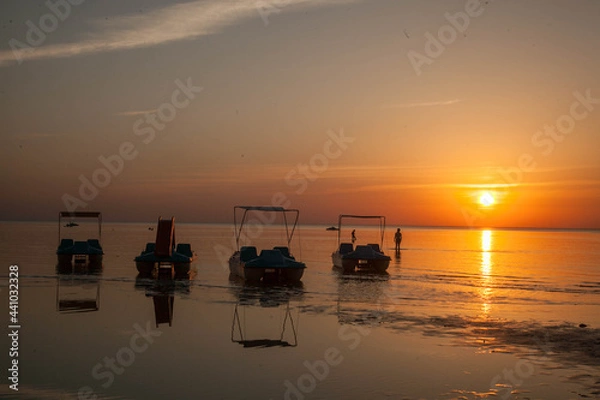 Obraz Summer sunset at sea. A resort place to relax at sunset. text place.