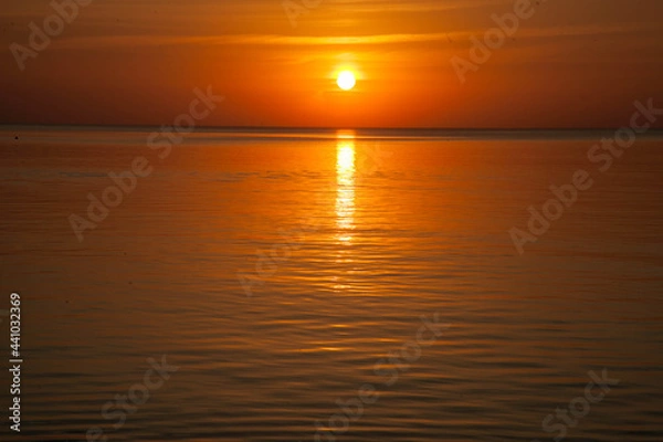 Obraz Summer sunset at sea. A resort place to relax at sunset. text place.