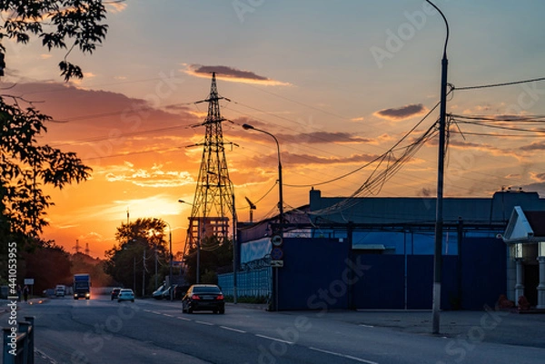 Obraz High-voltage power lines over sunset background
