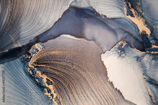 Fototapeta High resolution. Luxury abstract fluid art painting in alcohol ink technique, mixture of dark blue, gray and gold paints. Imitation of marble stone cut, glowing golden veins. Tender and dreamy design.