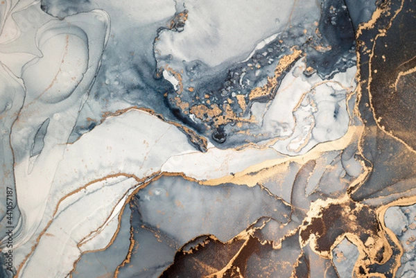 Fototapeta High resolution. Luxury abstract fluid art painting in alcohol ink technique, mixture of dark blue, gray and gold paints. Imitation of marble stone cut, glowing golden veins. Tender and dreamy design.
