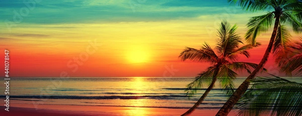 Fototapeta Beautiful sunset beach landscape, exotic tropical island nature, blue sea water, ocean waves, colorful red yellow sky, palm tree leaves silhouette, golden sun glow reflection, summer holidays vacation