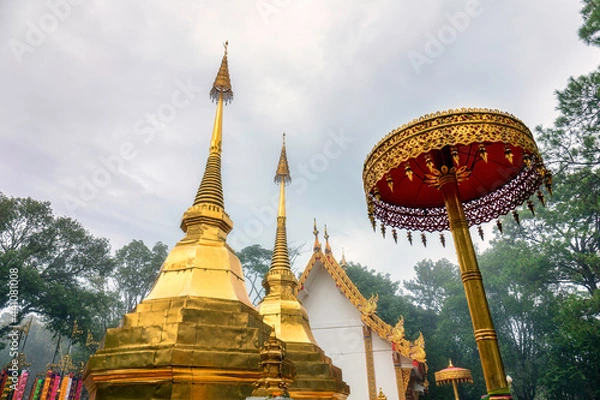 Obraz Doi Tung twin golden Buddha's relics in foggy day at Chiang Rai province norther of Thailand
