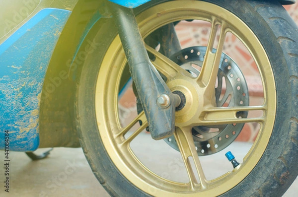Obraz Motorcycle front wheel with mud problem