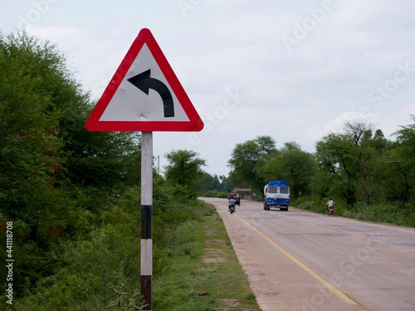 Obraz Road side arrow direction triangular shape board