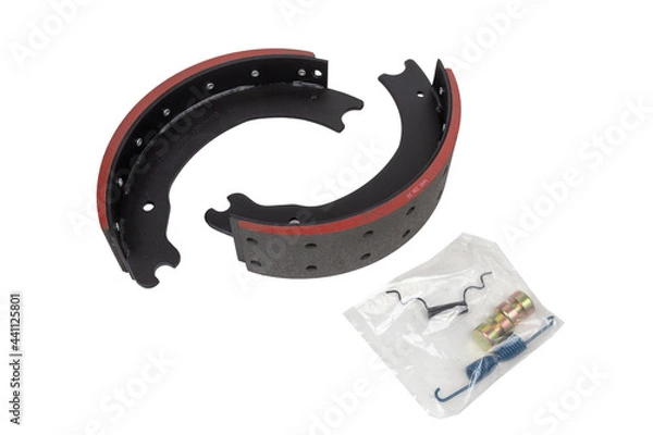 Fototapeta drilled brake pads with truck brake pads on an isolated white background. A set of two parts. With repair kit