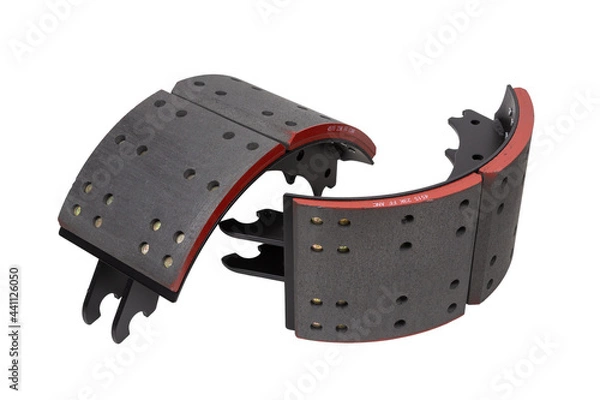 Fototapeta drilled brake pads with truck brake pads on an isolated white background. A two-part set
