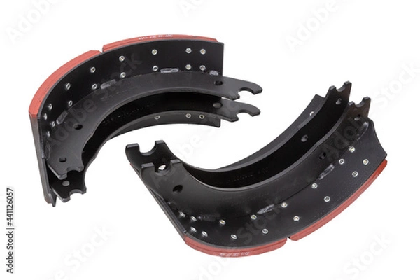 Fototapeta drilled brake pads with truck brake pads on an isolated white background. A two-part set