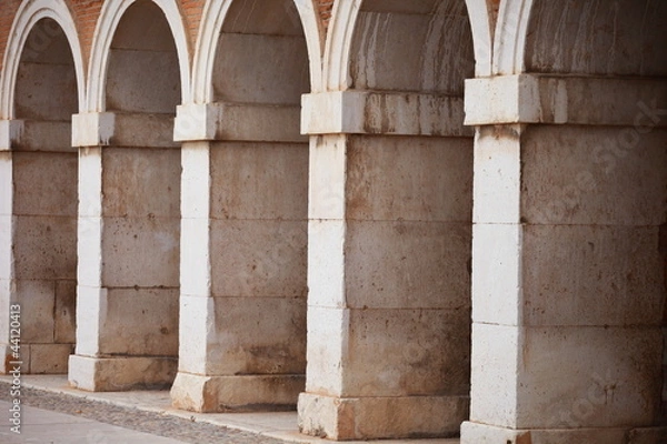 Fototapeta Long corridor in the exterior of the Royal Palace of Aranjuez