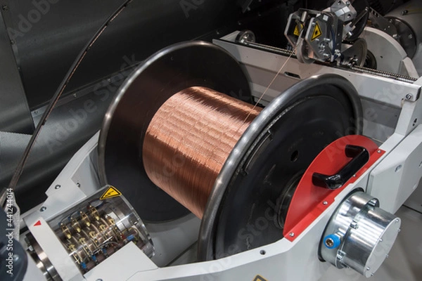 Obraz Large industrial copper wire coil. Wire winding machine.