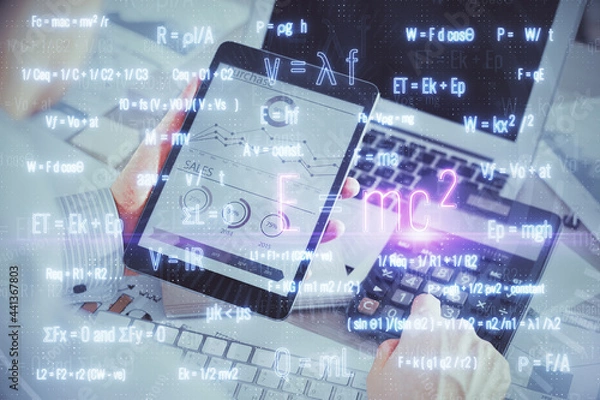 Fototapeta Double exposure of man's hands holding and using a phone and formulas drawing. Education concept.